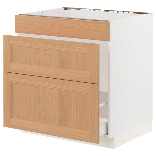 White SEKTION kitchen cabinet with oak drawers, minimalist design.