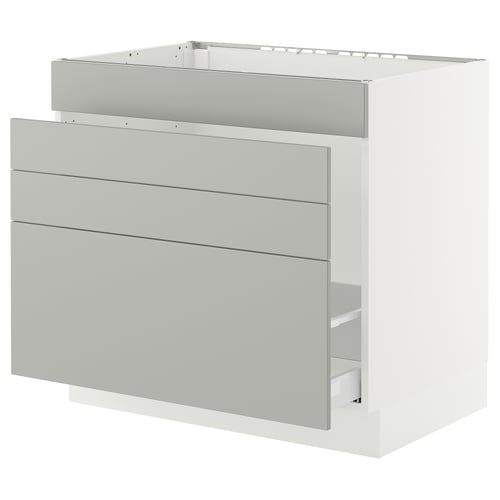 SEKTION light grey kitchen cabinet with three drawers and metal handles.