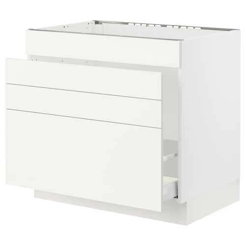 White SEKTION cabinet with smooth vallstena fronts and metal drawer.
