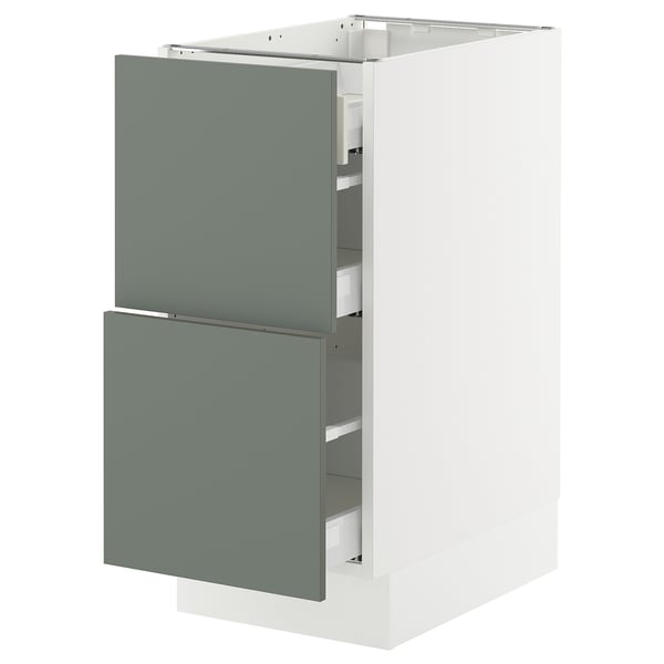 Modern kitchen cabinet with gray-green drawers and white base, sleek design.