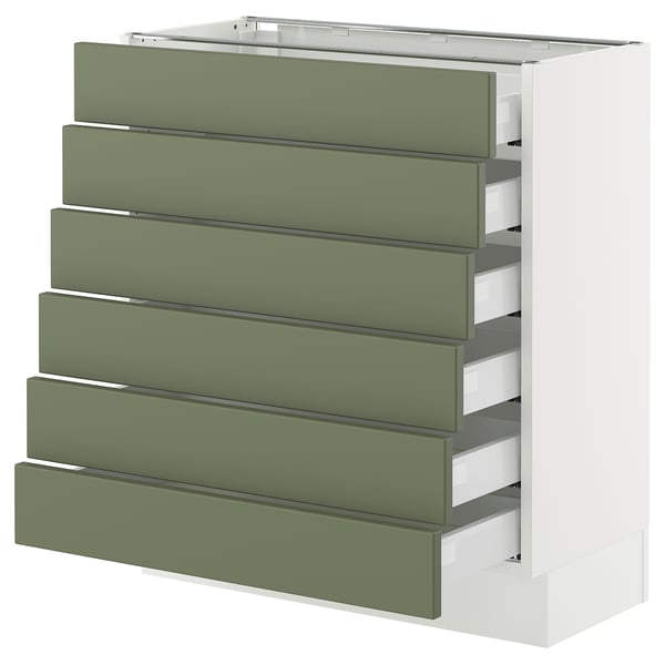 Grey-green kitchen unit with six drawers, modern design.