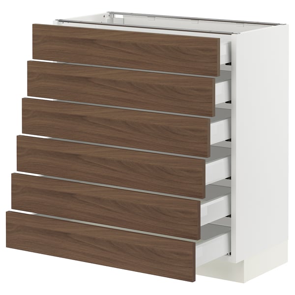 A SEKTION kitchen cabinet with walnut-colored drawers and white frame, designed with a modern and classic style.