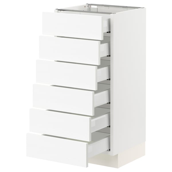 White kitchen drawer unit, six full-extension drawers, sleek modern design.
