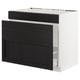 An ikea SEKTION kitchen cabinet in white with black-stained wood panels. It has a drawer, and the frame is sturdy.
