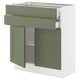 An ikea SEKTION kitchen cabinet with grey-green axstad doors and adjustable shelves.