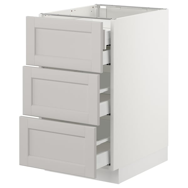 A white SEKTION kitchen base cabinet with three lerhyttan light grey drawers featuring bevelled edges.