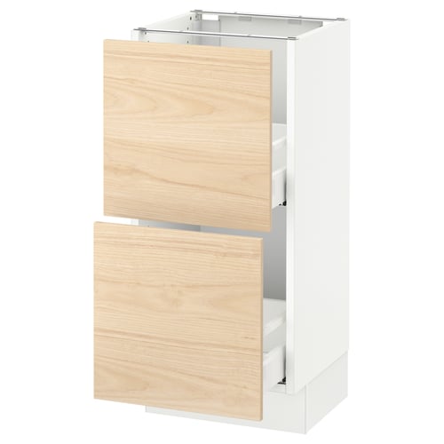 White kitchen base unit with light wooden drawers.
