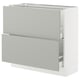 Modern white SEKTION kitchen cabinet with grey fronts, two drawers, and upper shelf.