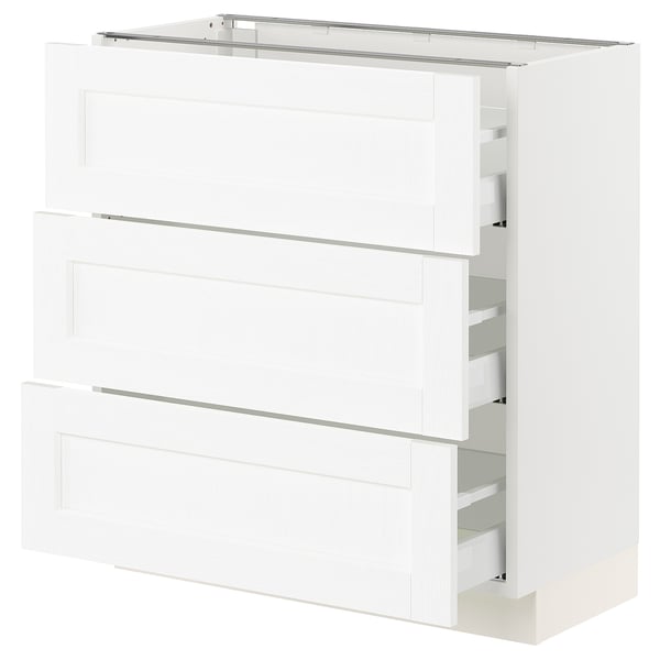 Displays a white SEKTION kitchen cabinet with grain texture. It multiple drawers with smooth, full-extension slides.