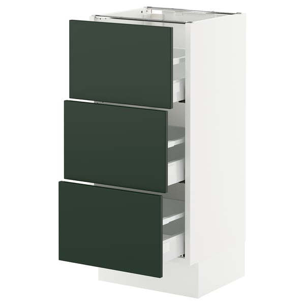 A white kitchen cabinet unit with three dark green drawers. It a sleek, modern design.