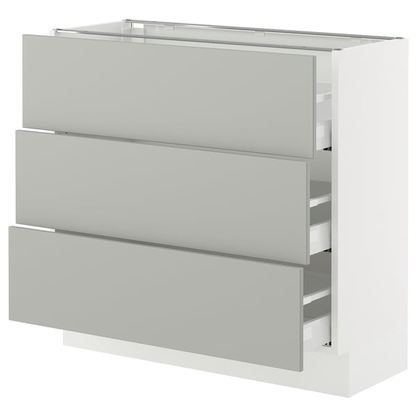 A white SEKTION kitchen cabinet with three drawers in light grey. Its modern and rectangular.
