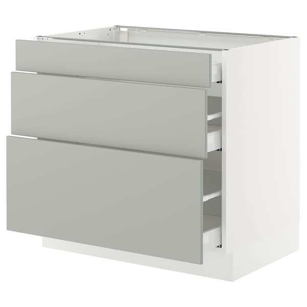 A white SEKTION kitchen cabinet with grey havstorp drawers in a modern design.