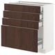 A modern kitchen cabinet called SEKTION. It dark brown wood drawers with a white frame, providing ample storage with multiple drawers.