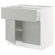 The SEKTION kitchen unit in light grey a drawer and open shelf, combining modern design with functional storage.