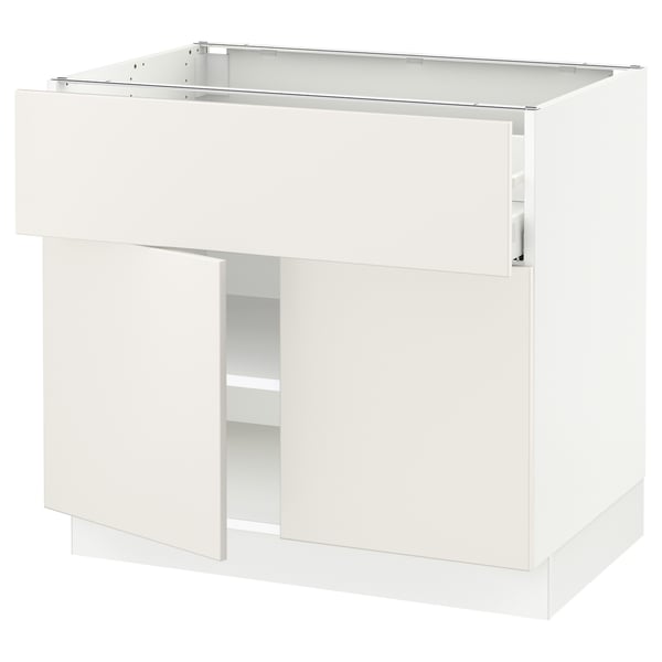 An ikea SEKTION white kitchen cabinet with smooth lines, featuring adjustable shelves and a soft-closing door.