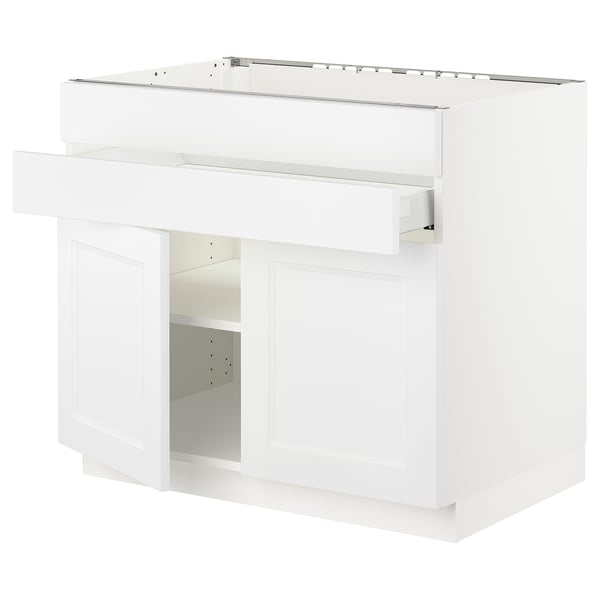 White ikea SEKTION kitchen unit with shelves and closed compartment, sleek modern design.