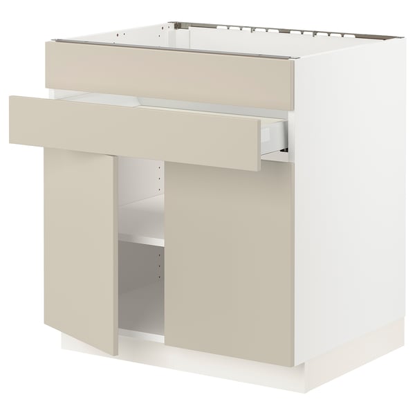 SEKTION kitchen unit in beige with smooth, clean lines and adjustable shelves.