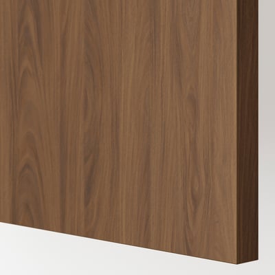 Close-up of modern kitchen cabinet with smooth walnut finish, showcasing fine wood grain texture.