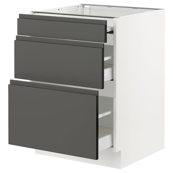 Modern white kitchen cabinet with three dark grey drawers.