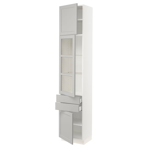 A white SEKTION kitchen cabinet with light grey glass doors and drawers. It both shelves and drawers for storage, designed with a classic look.