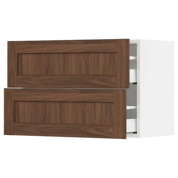 A wooden cabinet with two open drawers. The dark brown drawers have a smooth finish.
