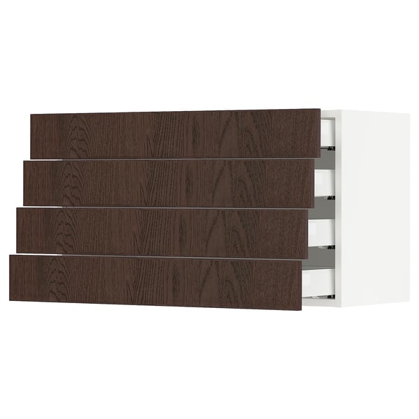 A dark brown wooden drawer set in a white cabinet. Four drawers are visible, with sleek handles and a modern design.