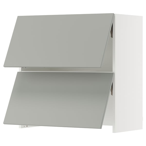 An ikea SEKTION light grey kitchen cabinet in a modern style. It has a rectangular shape and two slanted doors.