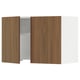 The SEKTION kitchen cabinet with a walnut finish and white frame, featuring a single open door revealing shelves inside.
