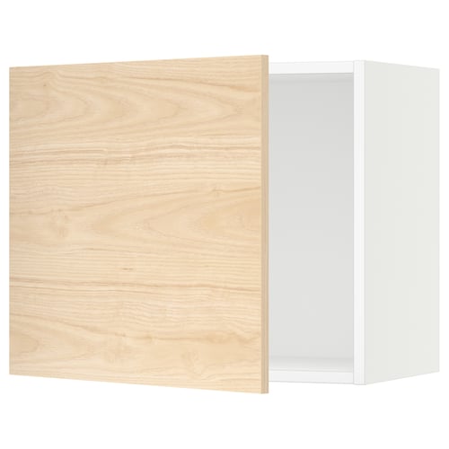 An open light oak-colored kitchen cabinet with a white interior. It a square shape and modern design.