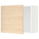 An open light oak-colored kitchen cabinet with a white interior. It a square shape and modern design.