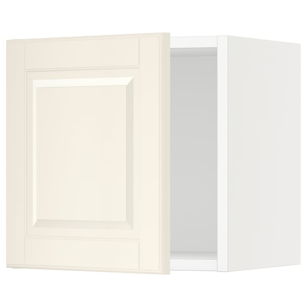 A white SEKTION kitchen cabinet with a panelled door featuring bevelled edges. Its rectangular with a sturdy frame and snap-on hinges.