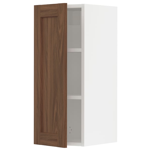 SEKTION kitchen cabinet in walnut and white, open door revealing shelves.