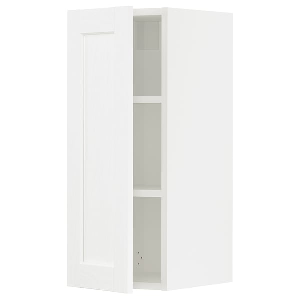 Depicts a white SEKTION wall cabinet from IKEA. It a sleek, modern design with two adjustable shelves.