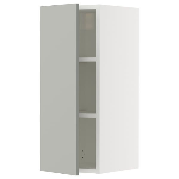 White SEKTION wall cabinet with grey glass shelf.