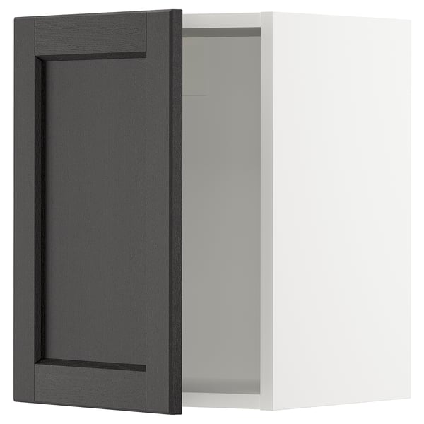 An open black stained wooden cabinet with a rectangular door featuring bevelled edges. The door is hinged to a white cabinet.