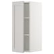 White SEKTION kitchen cabinet with adjustable shelves and bevelled edges.