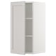 An open white ikea SEKTION wall cabinet with a single adjustable shelf. It a clean, classic design with a smooth, flat panel door.