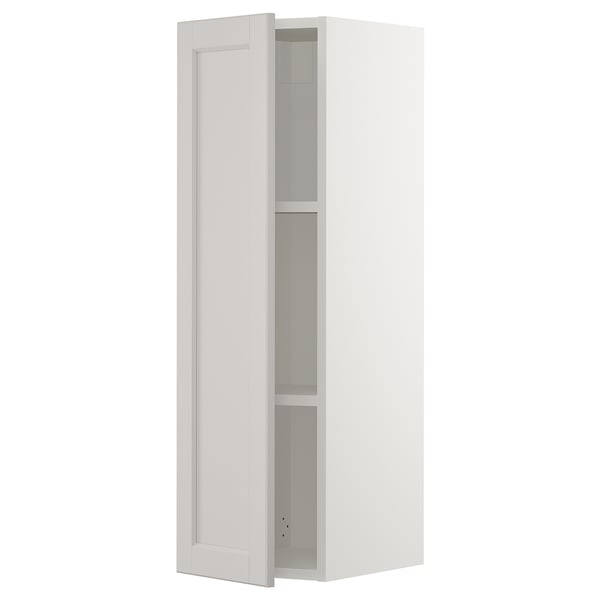 White SEKTION kitchen cabinet with adjustable shelves and bevelled door edge.
