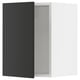 Black ikea SEKTION cabinet door, modern, partially open with soft-close hinge.