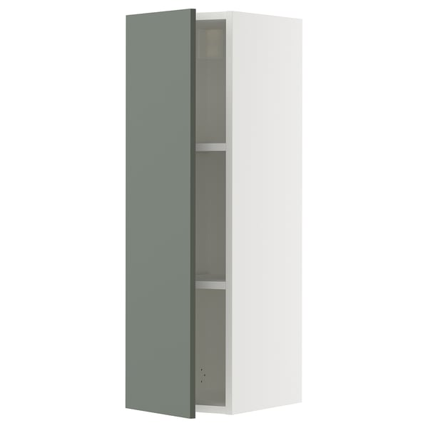 A white SEKTION kitchen cabinet with a grey-green door, featuring a sleek modern design.