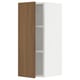 An open SEKTION kitchen cabinet with a wooden front door and white sides. It a modern walnut look with an adjustable shelf inside a sturdy frame.