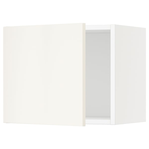 A white SEKTION kitchen cabinet with one open door, featuring clean lines and a sleek design.