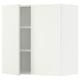 A white ikea SEKTION wall cabinet with one open door revealing shelves.