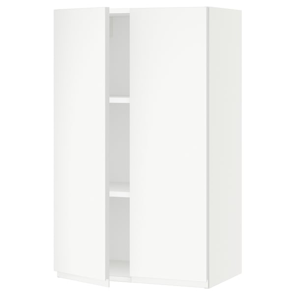 A white SEKTION kitchen cabinet with adjustable shelves and a soft-closing door.