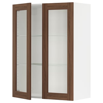 White SEKTION kitchen cabinet with walnut glass doors and adjustable shelves.