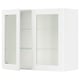 A white SEKTION kitchen cabinet with glass doors and metal hinges, featuring adjustable shelves.