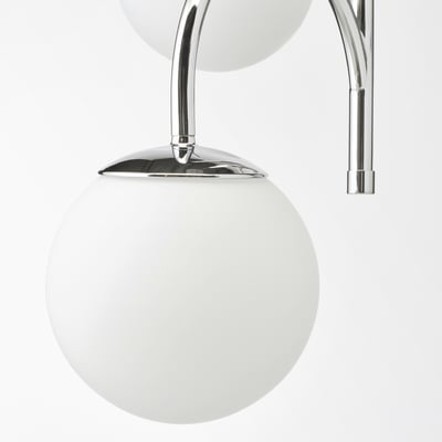 Modern chrome lamp with two frosted glass globes, reflecting elegant simplicity and high-quality design.