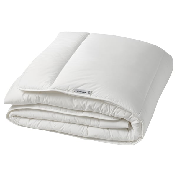 A white SKOGSFRÄKEN duvet folded. Its made of recycled polyester and lyocell for warmth and breathability.