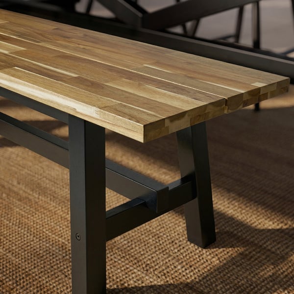 Modern, sturdy bench with natural wood top & black metal legs, showcasing quality craftsmanship & durability.