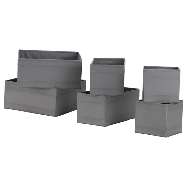 Six grey SKUBB storage boxes in various sizes, stacked neatly to showcase versatility in organising items.